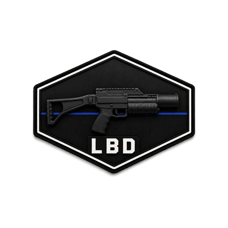 Black hexagon with a double border: the silhouette of a launcher resting on a thin blue line, inscription “LBD”.